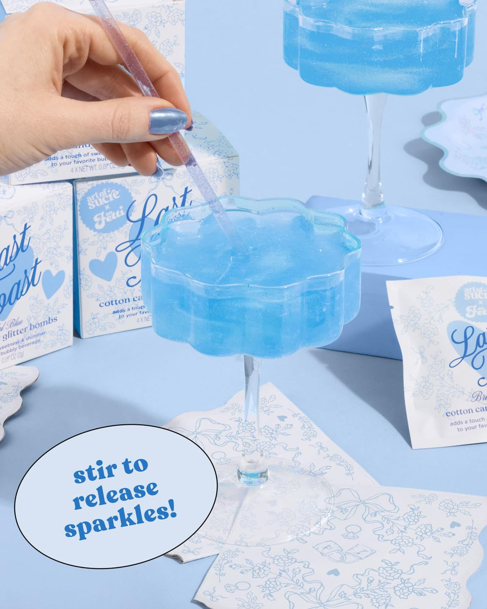 xo, Fetti bomb dissolving in champagne producing blue color and sparkling effect