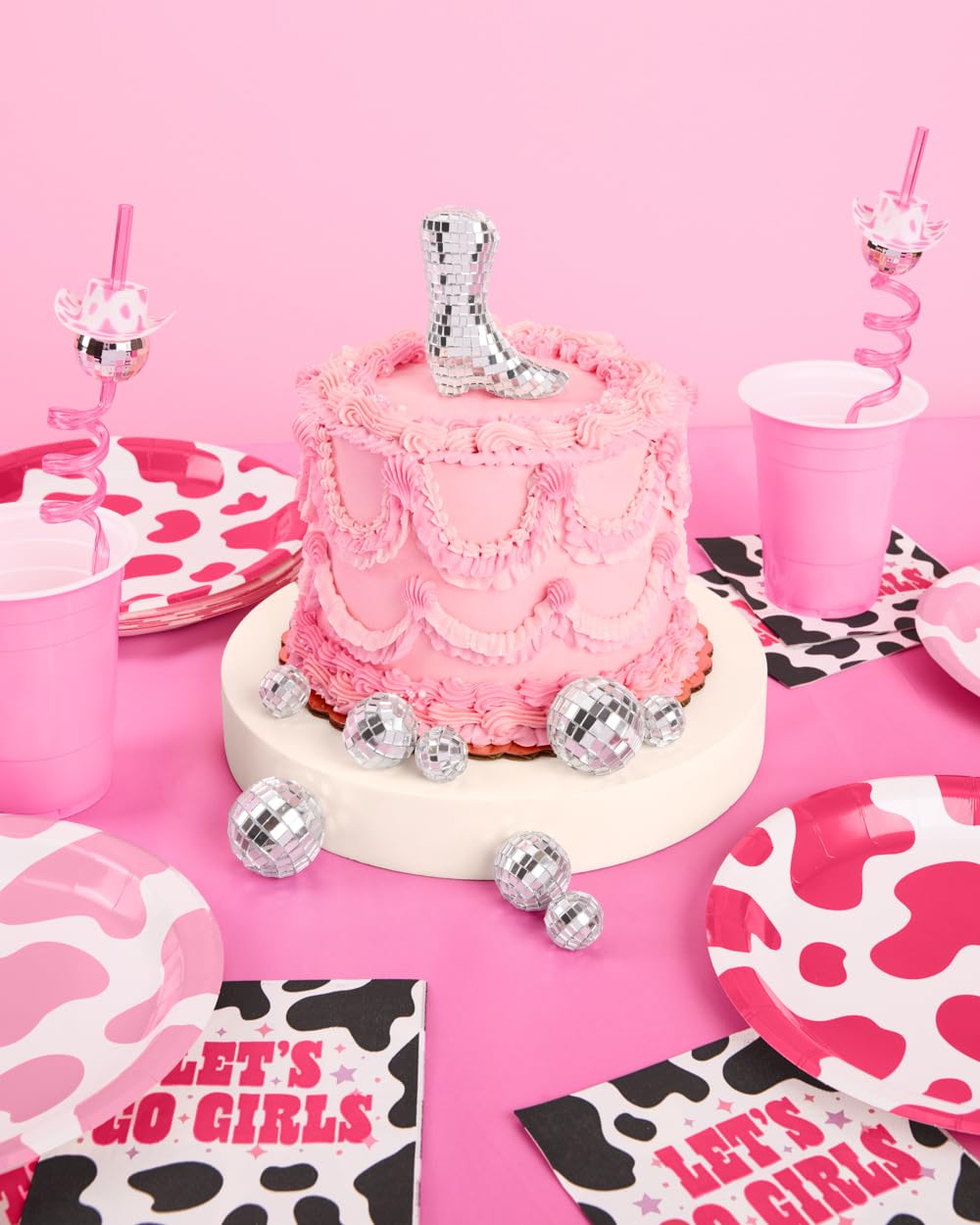 xo, Fetti topper on cake in party scene creating festive focal point