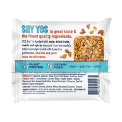 Hand holding a YES Bar apple cinnamon to show portable soft-chewy benefit