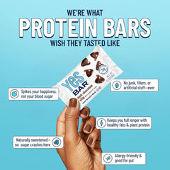 Hand holding a YES Bar Mini showing convenient portion and grab-and-go benefit
