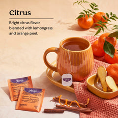 Brewed cup of Yogi tea steaming, showing soothing citrus aroma benefit