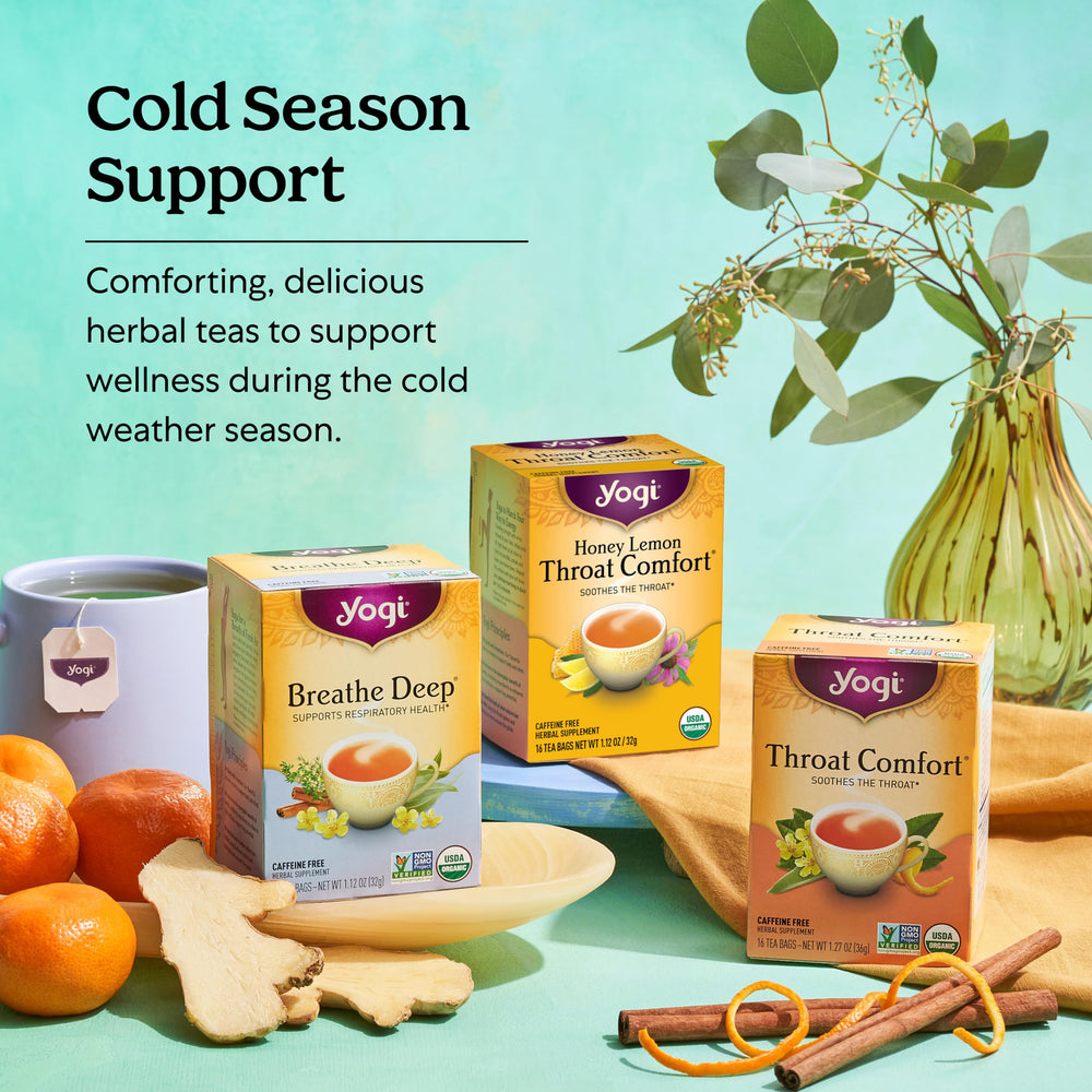 Yogi throat comfort ingredients arranged with orange peel and herbs for natural flavor