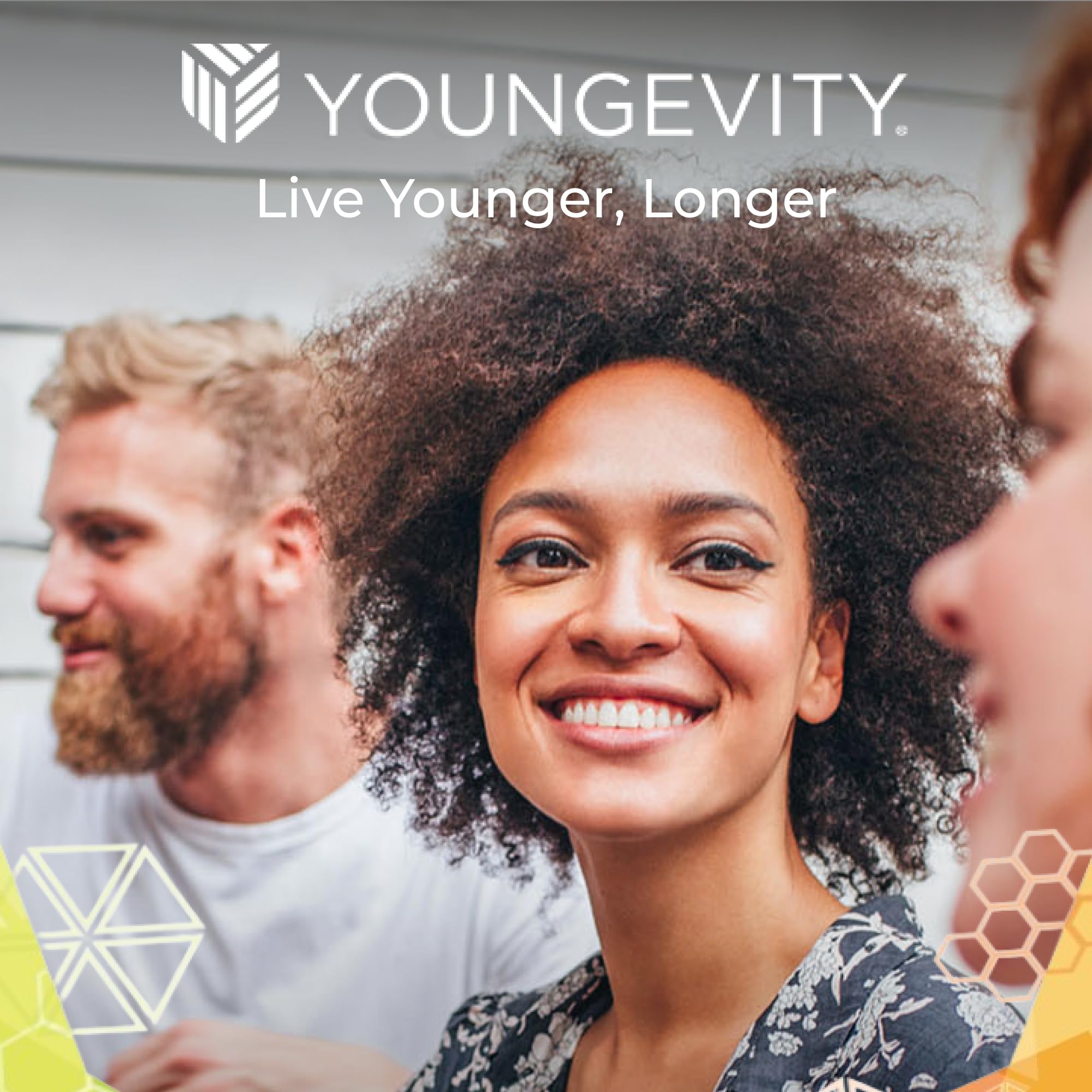 Youngevity bottle on kitchen counter with fruit, suggesting everyday use and fresh flavor