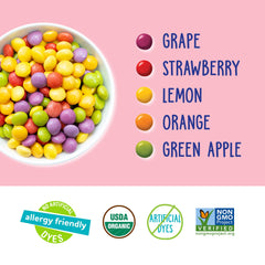 YumEarth assorted flavor packs laid out showing variety and kid-friendly appeal