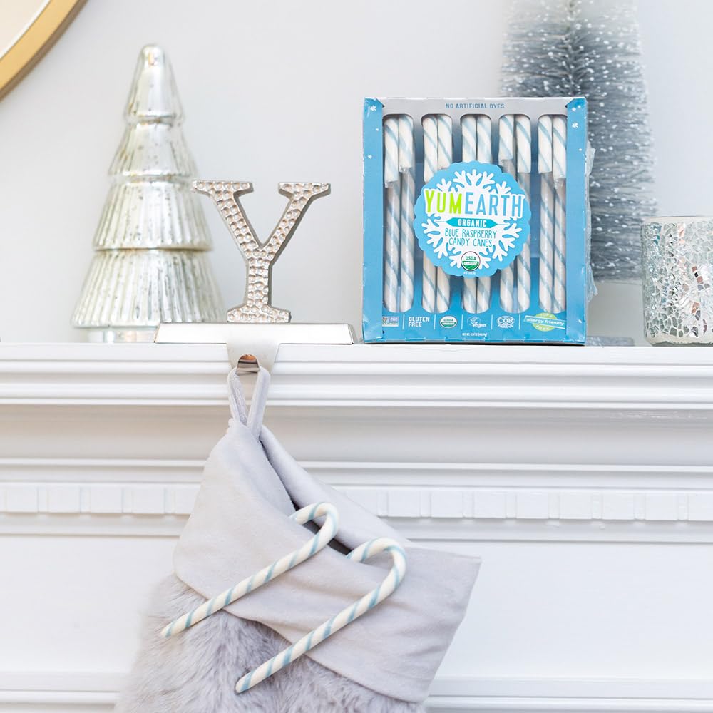 YumEarth candy cane hanging on tree adding colorful holiday decor benefit