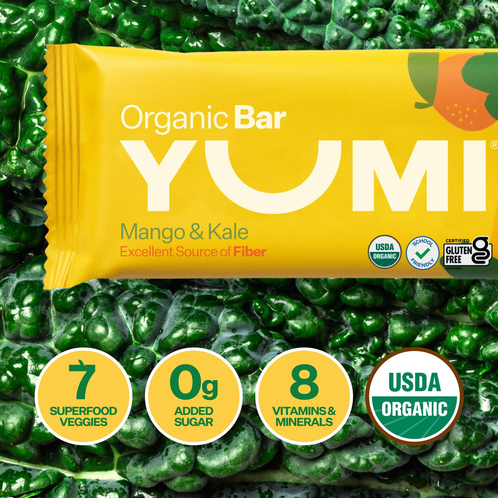 Hand holding YUMI bar for scale showing toddler-sized portion convenience