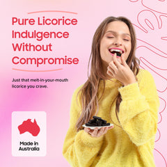 Yumkit hand holding a licorice piece demonstrating soft chew and easy eating