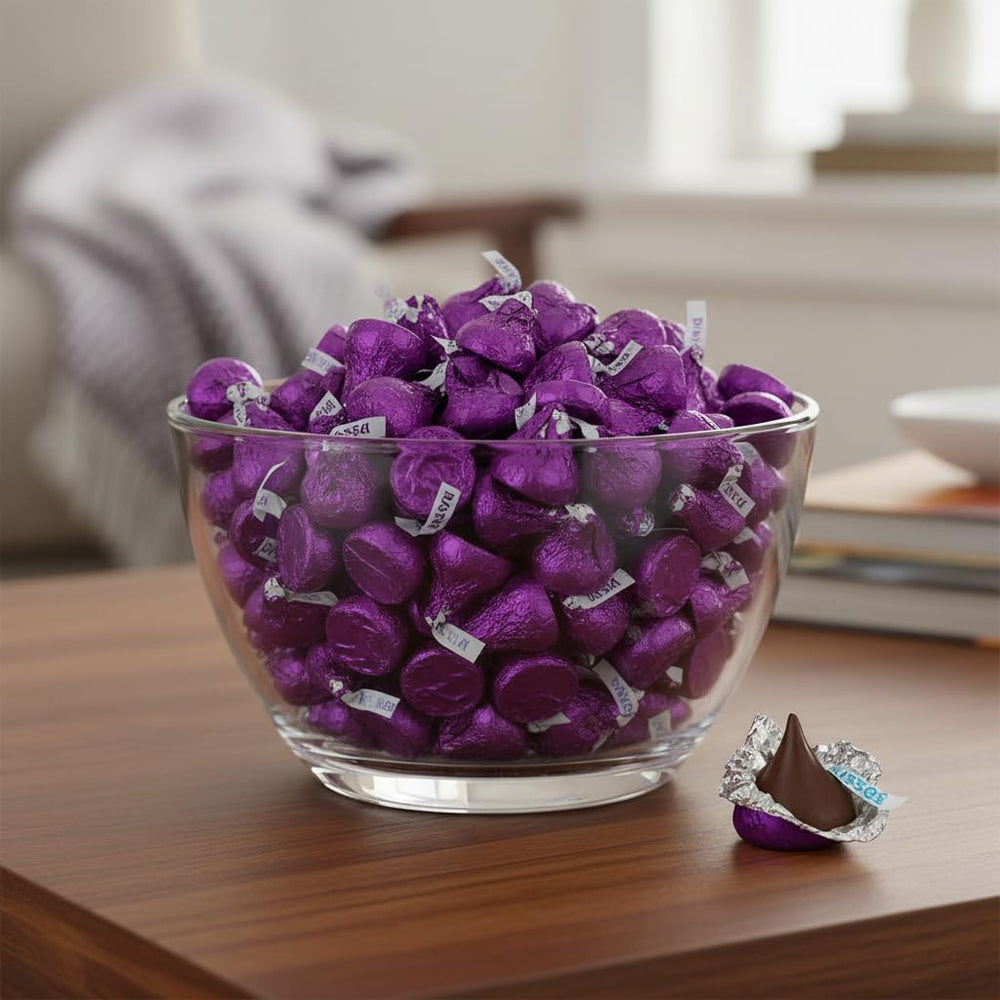 Yummy Chew close-up of purple foil wrapped Kiss highlighting elegant presentation