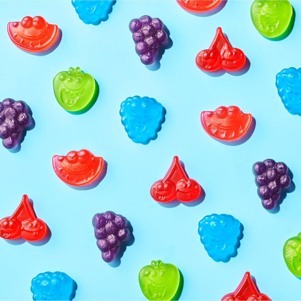 Yummy Chew assorted flavors laid out to display green apple, raspberry, cherry, grape, watermelon variety
