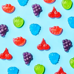Yummy Chew assorted flavors laid out to display green apple, raspberry, cherry, grape, watermelon variety