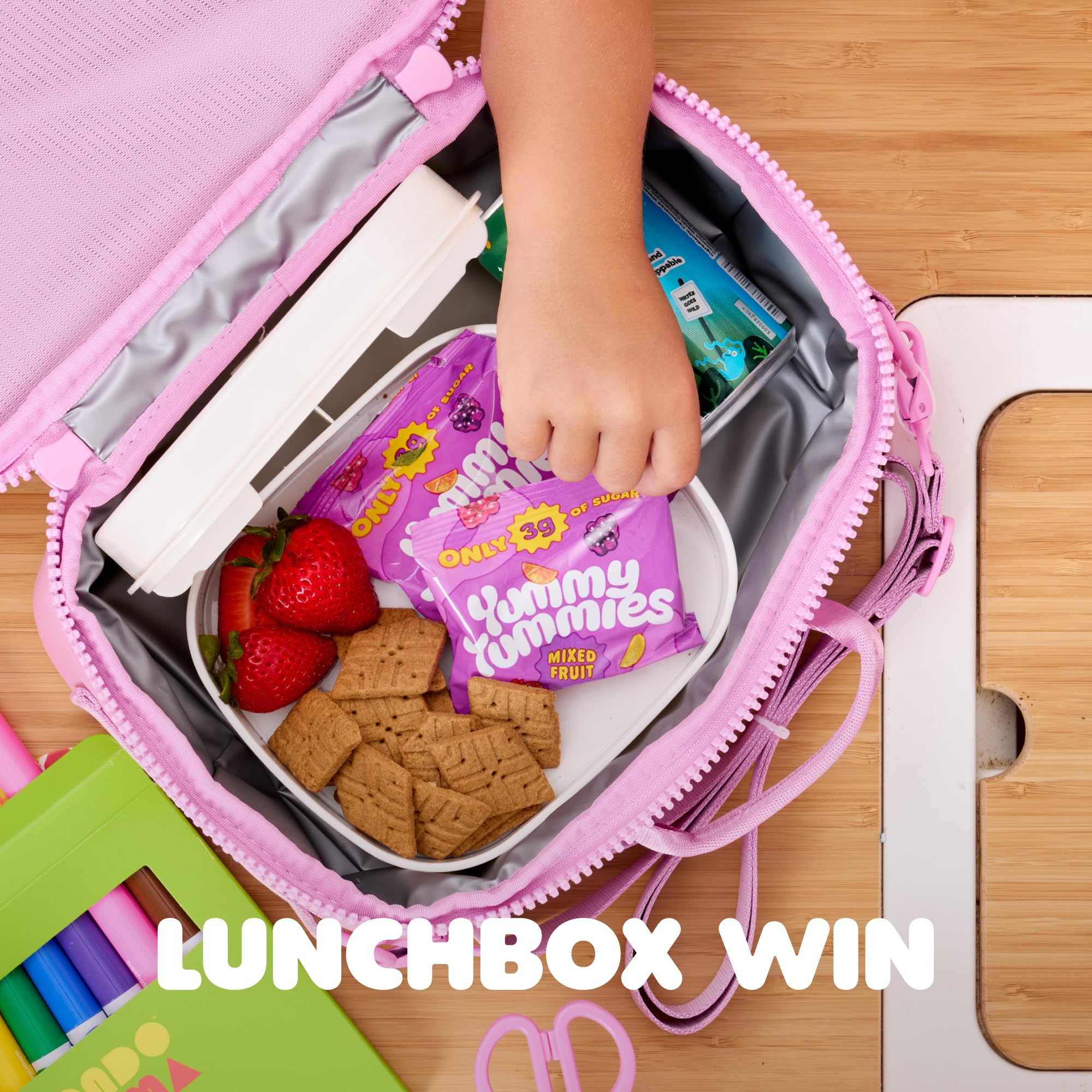 Yummy Tummies pouch next to a ruler showing compact portion and travel ease