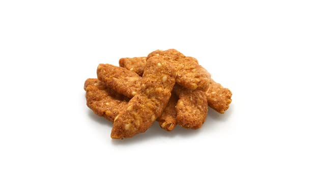 Yupik bowl of sesame sticks on a party table offering shareable snack