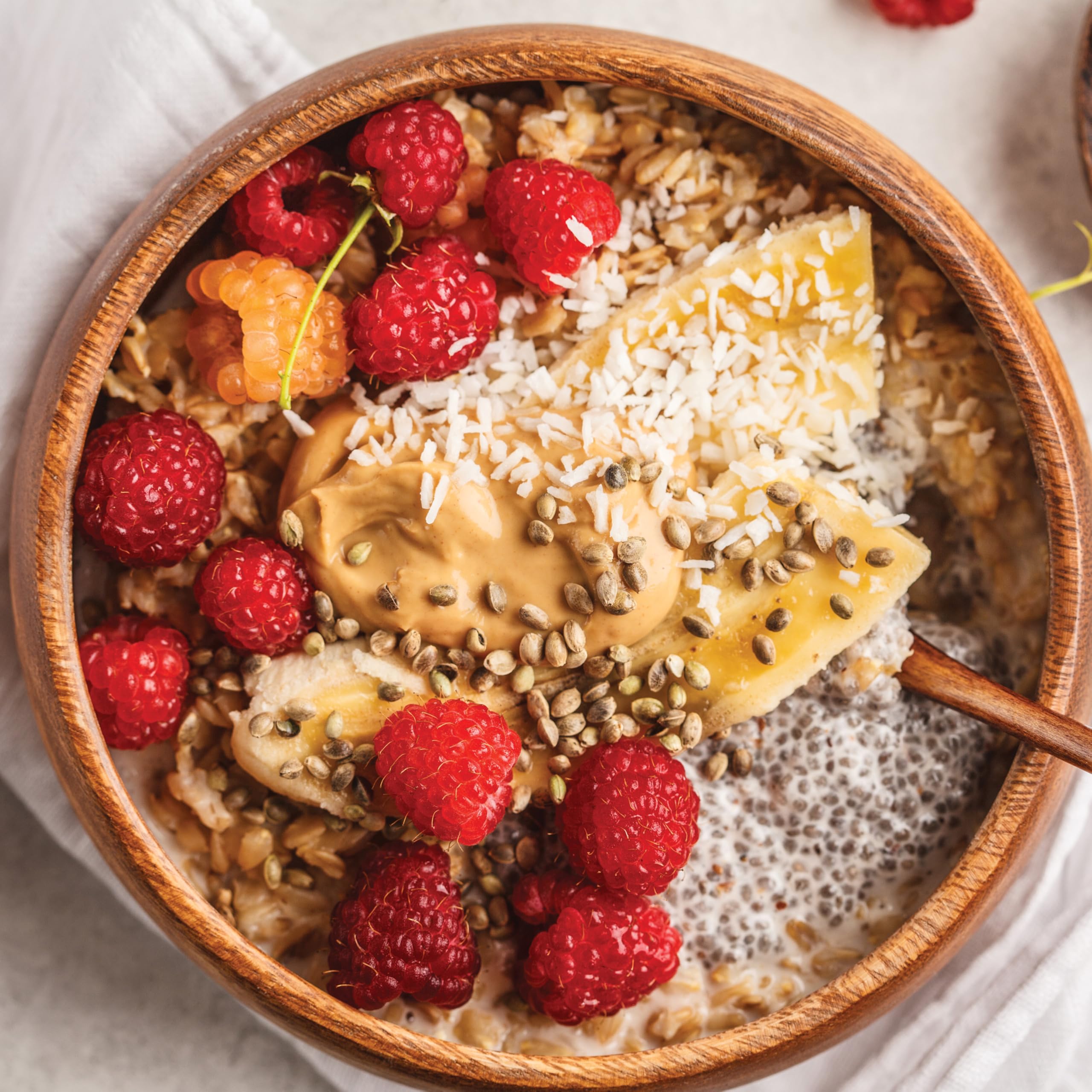 Bowl of oatmeal topped with Yupik seeds and fresh fruit for added fiber