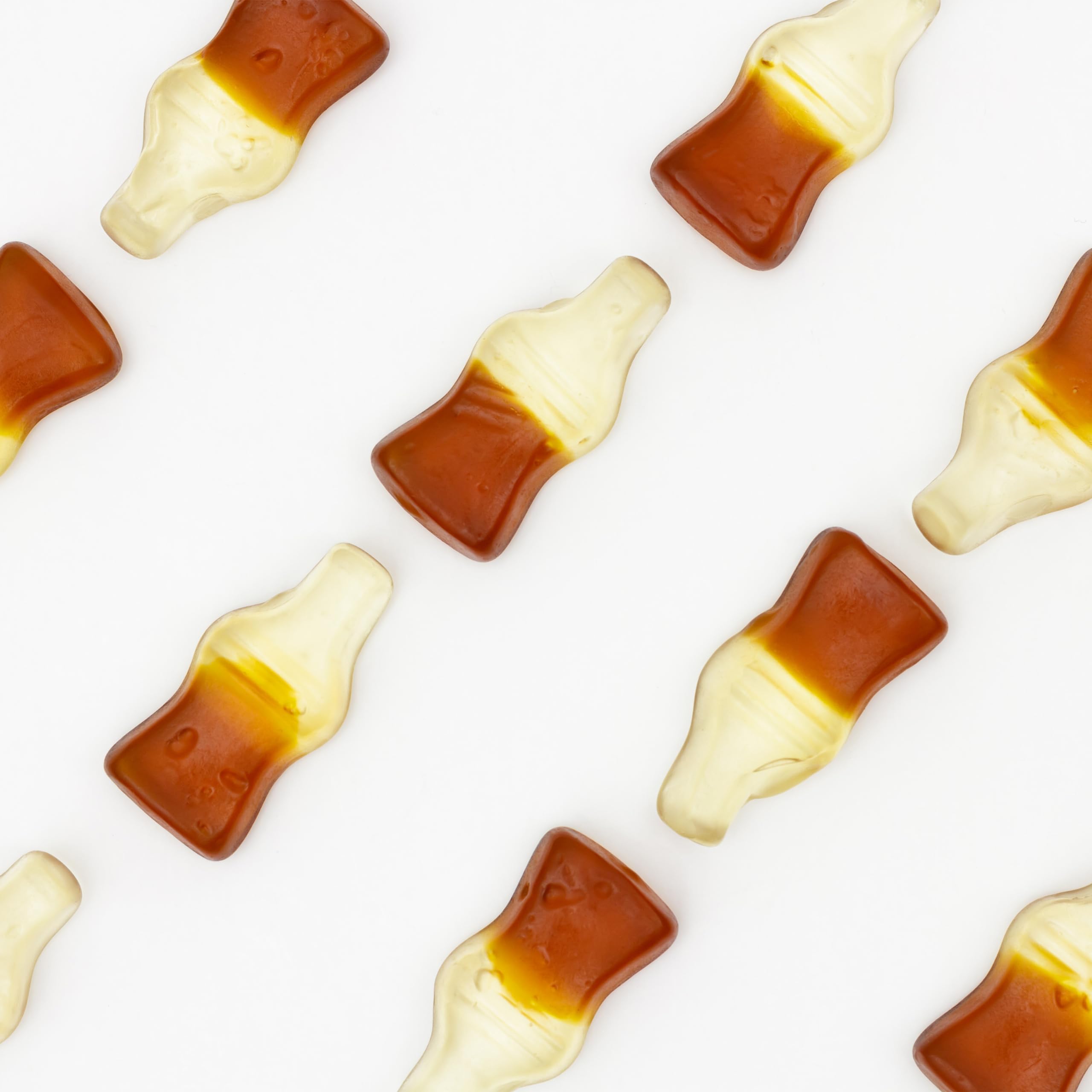 Yupik close-up of gummy cola bottle texture highlighting chewy appeal