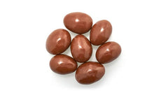 Yupik close-up of chocolate-coated almond highlighting smooth shell and crunchy benefit