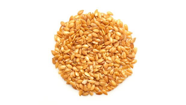 Yupik close-up of golden flax seeds texture offering crunchy, nutty benefit