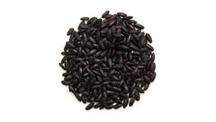 Yupik cooked ancient black rice close-up with purple hue, flavorful texture