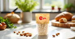 Yupik Marcona almonds next to measuring cup showing package quantity