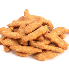 Yupik sesame sticks dipped in hummus showing dipping versatility