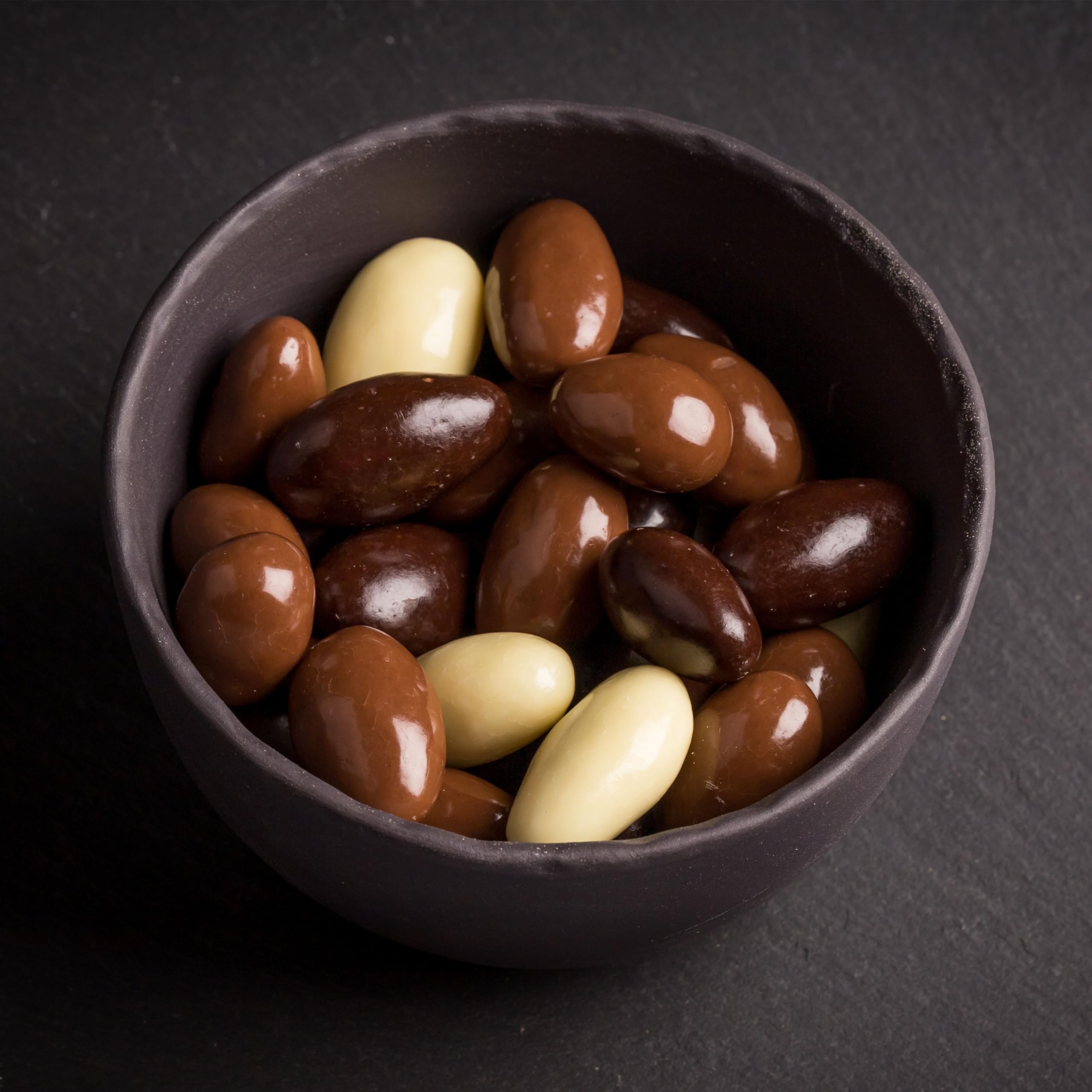 Yupik almonds held in hand for size comparison showing portion expectations and scale