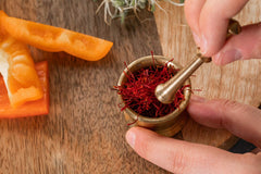 Zaffrus saffron steeping in warm liquid releasing color and aroma benefit