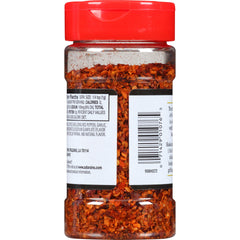 Zatarain's seasoning close-up texture highlighting coarse spices and aroma