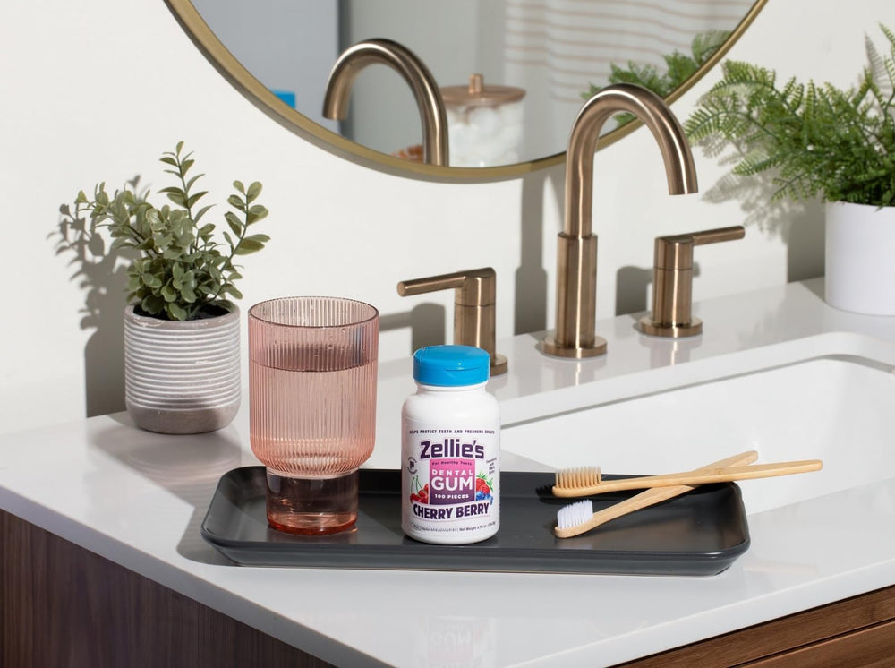 Zellies spearmint open tube in hand showing handful convenience and portable oral care benefit