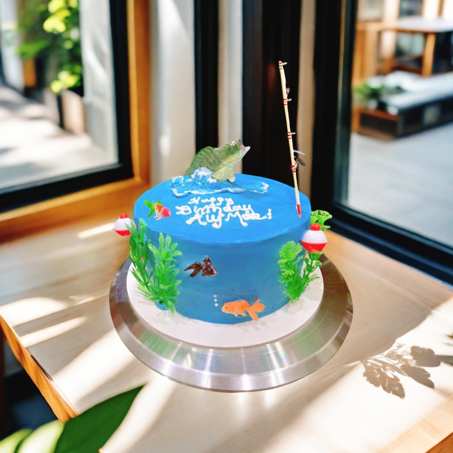 zHzHGuo three small goldfish arranged on cake adding playful movement